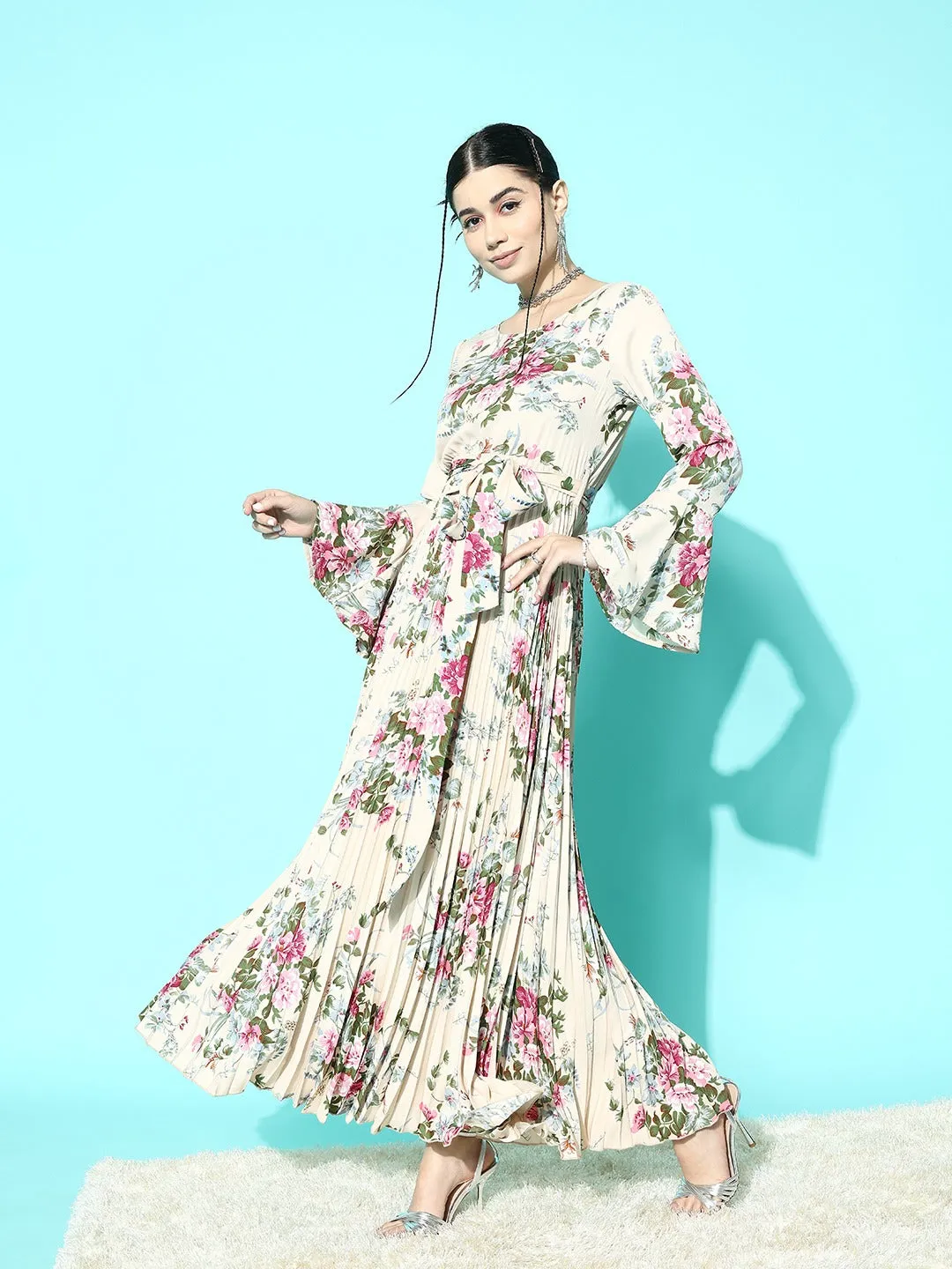 Berrylush Women Beige & Green Floral Printed Round Neck Bell Sleeves Waist Tie-Up Crepe Pleated A-Line Maxi Dress